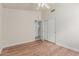 This bedroom provides wood-look floors and features a ceiling fan and closet at 4620 E Desert Cactus St, Phoenix, AZ 85032