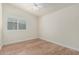 This bedroom offers wood-look floors and a ceiling fan for comfortable living at 4620 E Desert Cactus St, Phoenix, AZ 85032