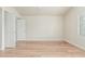 Empty bedroom with wood flooring, white walls, baseboards and trim, and a window with shutter at 4620 E Desert Cactus St, Phoenix, AZ 85032