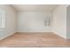 Empty bedroom featuring hardwood floors, neutral walls, white trim, and a window with shutters at 4620 E Desert Cactus St, Phoenix, AZ 85032