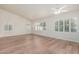 Bright, spacious bedroom featuring plantation shutters and modern wood-look flooring at 4620 E Desert Cactus St, Phoenix, AZ 85032