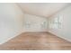 Bright, spacious bedroom featuring plantation shutters and modern wood-look flooring at 4620 E Desert Cactus St, Phoenix, AZ 85032