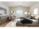 Relaxing bedroom with vaulted ceiling, arched window, and modern decor at 4620 E Desert Cactus St, Phoenix, AZ 85032