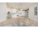 Bright kitchen with white cabinetry, an island, and an open layout at 4620 E Desert Cactus St, Phoenix, AZ 85032