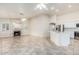 Open-concept living space featuring a fireplace, tile flooring, and connection to the kitchen at 4620 E Desert Cactus St, Phoenix, AZ 85032