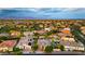 Panoramic aerial view of a neighborhood, showcasing homes with pools, lush landscaping, and desert mountain views at 4865 S Cylinder Way, Mesa, AZ 85212
