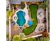Expansive backyard featuring a pool, spa, putting green, fire pit, dining area, and meticulous landscaping at 4865 S Cylinder Way, Mesa, AZ 85212