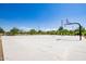 Outdoor community basketball court with several hoops and lush landscaping surrounding it at 4865 S Cylinder Way, Mesa, AZ 85212