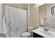 Cozy bathroom featuring a shower with patterned curtain, toilet, sink, and a decorative towel rack at 4865 S Cylinder Way, Mesa, AZ 85212