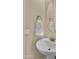 Bathroom with pedestal sink, decorative mirror and towel rack at 4865 S Cylinder Way, Mesa, AZ 85212