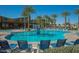 Resort-style community pool with a basketball hoop, lounge chairs and plenty of palm trees at 4865 S Cylinder Way, Mesa, AZ 85212