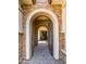 Elegant arched entrance leading to the home's interior at 4865 S Cylinder Way, Mesa, AZ 85212
