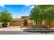 Charming single-story home with a well-manicured lawn, a two car garage and beautiful desert landscaping at 4865 S Cylinder Way, Mesa, AZ 85212