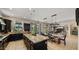 Open concept kitchen with oversized island, stainless appliances, and adjacent dining area at 4865 S Cylinder Way, Mesa, AZ 85212