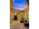 Cozy covered patio with brick flooring and comfortable seating at 4865 S Cylinder Way, Mesa, AZ 85212