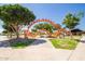 Fun playground with a unique orange climbing structure, slides, and various play elements at 4865 S Cylinder Way, Mesa, AZ 85212