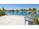Relaxing waterfront view of a lake and a gazebo from a concrete bench at 4865 S Cylinder Way, Mesa, AZ 85212