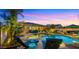 Inviting pool and spa area featuring comfortable lounge chairs under a gorgeous sunset at 4865 S Cylinder Way, Mesa, AZ 85212
