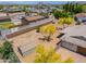 Aerial shot of backyard, enclosed by fence with a shed and mature trees at 6502 E Rustic Dr, Mesa, AZ 85215