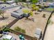 Aerial view of the property showcasing the spacious, enclosed dirt backyard and shed at 6502 E Rustic Dr, Mesa, AZ 85215