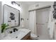 Modern bathroom featuring updated fixtures, sleek mirror, and walk in shower at 6502 E Rustic Dr, Mesa, AZ 85215