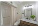Updated bathroom with modern fixtures, including a shower, vanity, and sink at 6502 E Rustic Dr, Mesa, AZ 85215