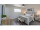 Serene bedroom features a tufted headboard and stylish furnishings at 6502 E Rustic Dr, Mesa, AZ 85215