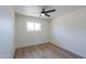 Bright bedroom offers vinyl floors, neutral paint, and ample natural light at 6502 E Rustic Dr, Mesa, AZ 85215