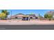 Charming home with modern updates, solar panels, and a cozy front porch at 6502 E Rustic Dr, Mesa, AZ 85215