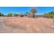 Spacious front yard featuring desert landscaping and ample parking space at 6502 E Rustic Dr, Mesa, AZ 85215