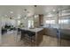 Open-concept kitchen featuring quartz countertops, stainless steel appliances, and stylish pendant lighting at 6502 E Rustic Dr, Mesa, AZ 85215