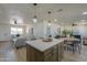 Spacious kitchen with island seating that opens to the living and dining areas at 6502 E Rustic Dr, Mesa, AZ 85215