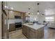 Stylish kitchen featuring stainless steel appliances, subway tile backsplash, and open layout at 6502 E Rustic Dr, Mesa, AZ 85215