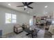 Bright open living room featuring sleek ceiling fan and modern decor at 6502 E Rustic Dr, Mesa, AZ 85215