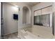 Bathroom features a large tub with window, providing a relaxing and bright space at 661 S Hawes Rd # 81, Mesa, AZ 85208