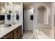Well-lit bathroom featuring a vanity with a sink, and a combined bathtub and shower at 661 S Hawes Rd # 81, Mesa, AZ 85208