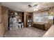 Bedroom with a fan and work area, providing a versatile and functional space at 661 S Hawes Rd # 81, Mesa, AZ 85208