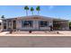 Exterior view showing desert landscaping, covered carport, and lovely curb appeal at 661 S Hawes Rd # 81, Mesa, AZ 85208