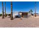 Charming single-story home with a covered patio and desert landscaping, perfect for low-maintenance living at 661 S Hawes Rd # 81, Mesa, AZ 85208