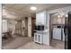 Open kitchen layout featuring a dining area, built-in hutch, and laundry nook at 661 S Hawes Rd # 81, Mesa, AZ 85208