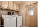 Laundry room with a washer and dryer, and a door to the exterior at 661 S Hawes Rd # 81, Mesa, AZ 85208
