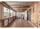 View of a unfinished sunroom with lots of natural light shining through the many windows at 661 S Hawes Rd # 81, Mesa, AZ 85208