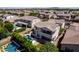 Spacious backyard features a pool, manicured lawn, and desert landscaping at 882 E Parkview Dr, Gilbert, AZ 85295