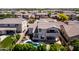 House backyard with a pool, patio, landscaping, and a second story balcony at 882 E Parkview Dr, Gilbert, AZ 85295