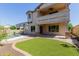 Home's backyard features a pool, patio, and artificial turf at 882 E Parkview Dr, Gilbert, AZ 85295