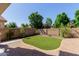 Well-maintained backyard featuring artificial turf and a brick-paved patio for outdoor enjoyment at 882 E Parkview Dr, Gilbert, AZ 85295