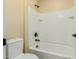 Bright bathroom features a tiled shower over tub with bronze fixtures at 882 E Parkview Dr, Gilbert, AZ 85295
