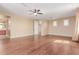 Large, airy bedroom with hardwood floors, a ceiling fan and access to an en suite bathroom at 882 E Parkview Dr, Gilbert, AZ 85295