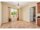 Bright dining area with neutral walls, tile floor, and a large window overlooking the yard at 882 E Parkview Dr, Gilbert, AZ 85295