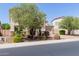 Beautiful home with a well-maintained lawn and mature tree providing shade and curb appeal at 882 E Parkview Dr, Gilbert, AZ 85295